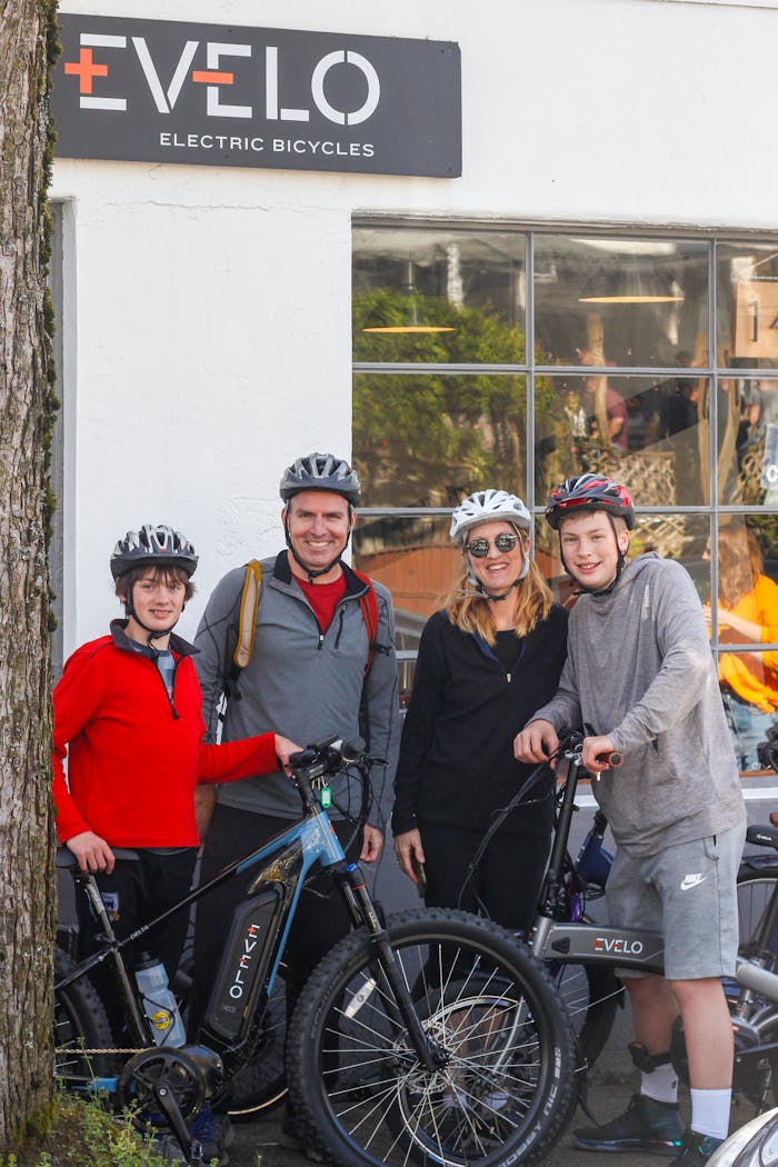 services-02 Family with electric bicycles outside an Evelo showroom in Seattle, WA.